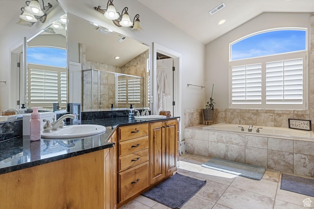 bathroom with vaulted ceiling, a sink, visible vents, and a stall shower