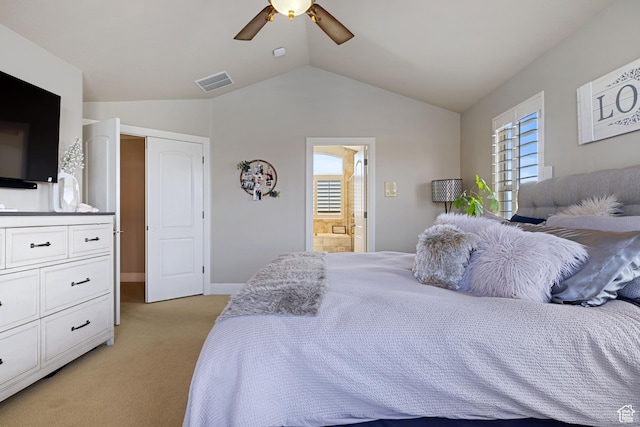 bedroom with vaulted ceiling, visible vents, light carpet, ceiling fan, and ensuite bathroom