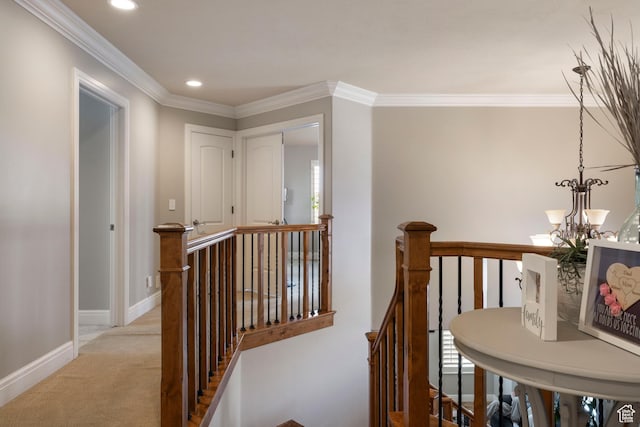 corridor featuring recessed lighting, ornamental molding, an upstairs landing, baseboards, and light colored carpet