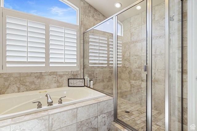 full bathroom featuring a bath, recessed lighting, and a shower stall