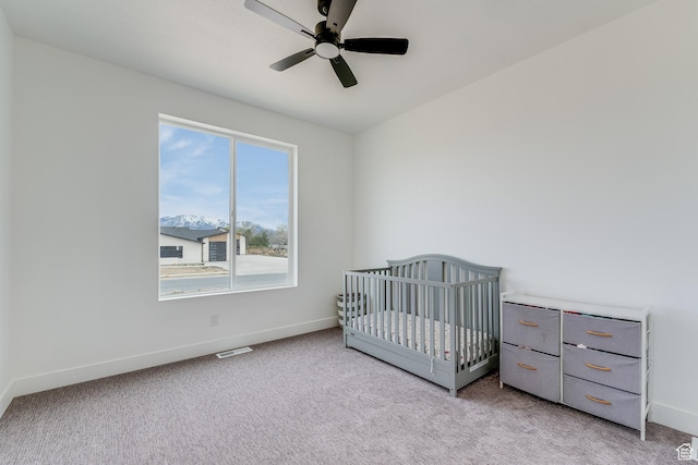 1993 S 5000 W, Taylor, UT 84401 - bedroom with baseboards, visible vents, light colored carpet, a ceiling fan, and a crib