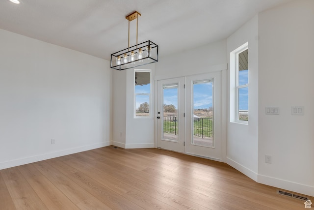 1993 S 5000 W, Taylor, UT 84401 - unfurnished dining area featuring visible vents, light wood finished floors, and baseboards