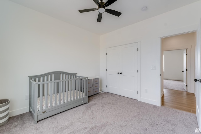 1993 S 5000 W, Taylor, UT 84401 - carpeted bedroom with baseboards, a ceiling fan, a crib, and a closet