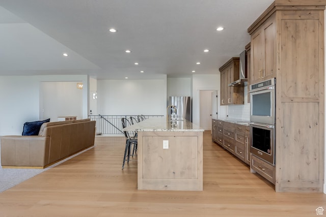 1993 S 5000 W, Taylor, UT 84401 - kitchen with a kitchen breakfast bar, a sink, appliances with stainless steel finishes, light stone countertops, and recessed lighting