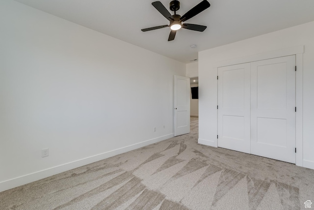 1993 S 5000 W, Taylor, UT 84401 - unfurnished bedroom with ceiling fan, baseboards, a closet, and carpet