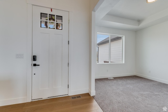 1993 S 5000 W, Taylor, UT 84401 - foyer entrance featuring visible vents, baseboards, a raised ceiling, and light wood-type flooring