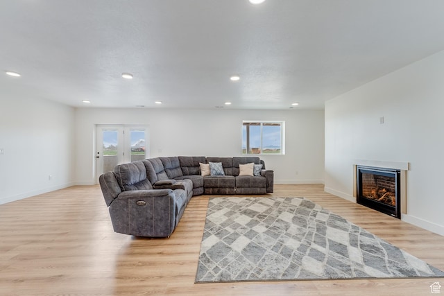 1993 S 5000 W, Taylor, UT 84401 - living room featuring baseboards, recessed lighting, a lit fireplace, and light wood-type flooring