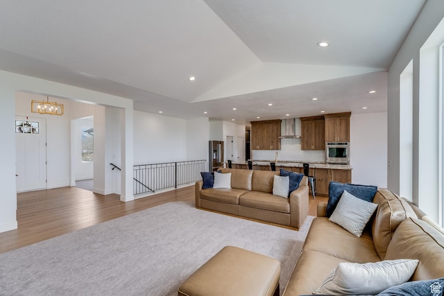 1993 S 5000 W, Taylor, UT 84401 - living area with light wood finished floors, recessed lighting, a chandelier, and lofted ceiling