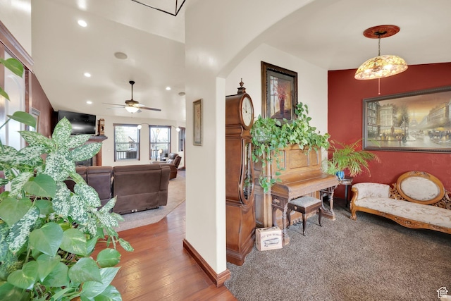 interior space with recessed lighting, arched walkways, a ceiling fan, and wood finished floors