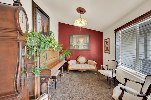 living area with carpet flooring and vaulted ceiling