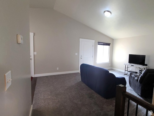 living room featuring dark carpet, vaulted ceiling, and baseboards