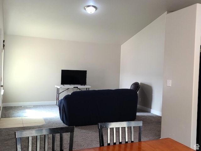 dining area with baseboards and carpet