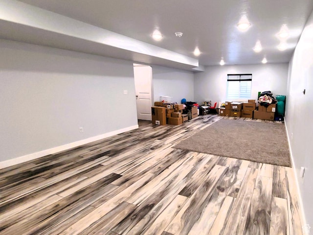 game room featuring baseboards and wood finished floors