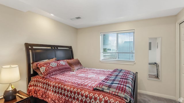 carpeted bedroom with baseboards and visible vents