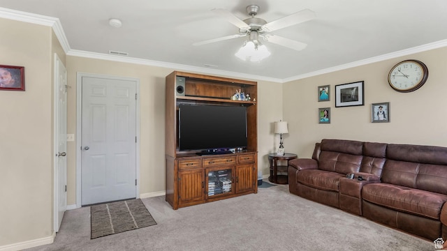 living area with baseboards, crown molding, light colored carpet, and a ceiling fan