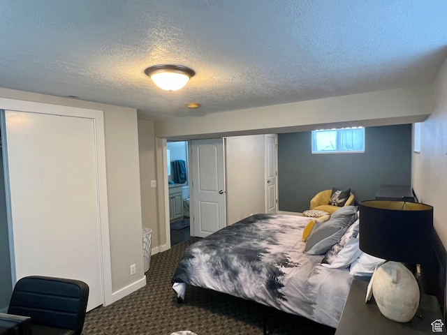 715 Oak Dr, Brigham City, UT 84302 - bedroom with dark carpet, baseboards, and a textured ceiling