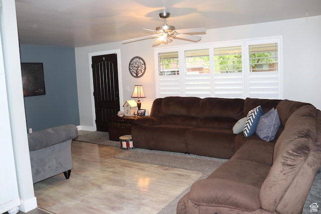 715 Oak Dr, Brigham City, UT 84302 - living room featuring wood finished floors, a wealth of natural light, a ceiling fan, and baseboards