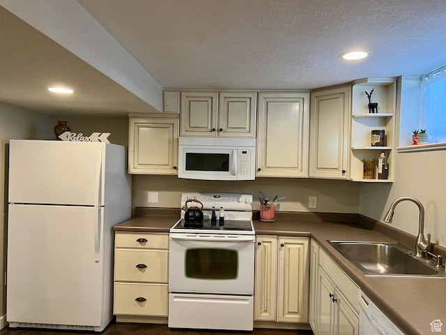 715 Oak Dr, Brigham City, UT 84302 - kitchen featuring cream cabinetry, a sink, white appliances, and recessed lighting