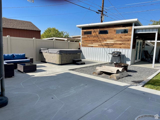 715 Oak Dr, Brigham City, UT 84302 - view of patio featuring fence, an outdoor hangout area, and a hot tub