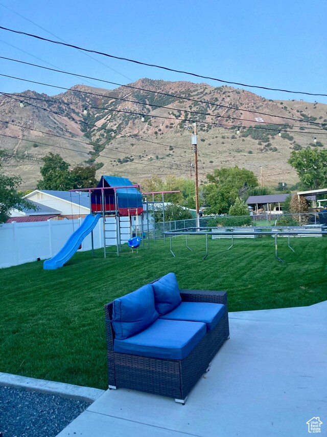 715 Oak Dr, Brigham City, UT 84302 - exterior space featuring playground community, fence, and a mountain view