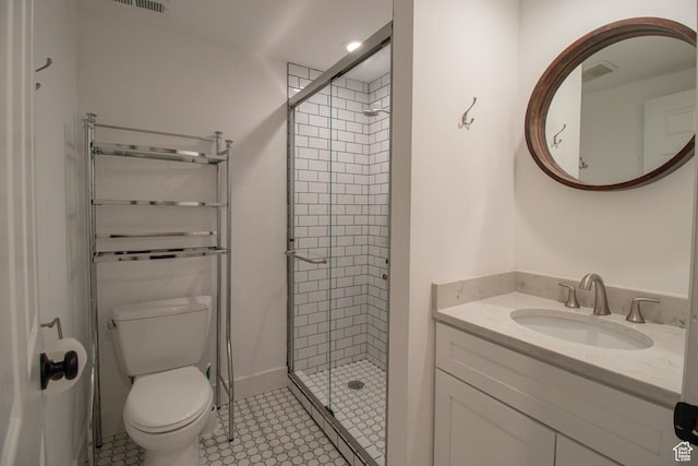 full bath featuring visible vents, toilet, vanity, and a stall shower