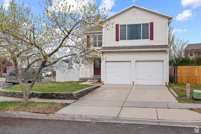 718 N 410 W, Tooele, UT 84074 - traditional home featuring driveway, fence, and a garage