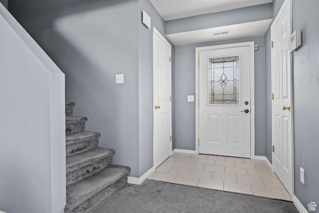 718 N 410 W, Tooele, UT 84074 - tiled entrance foyer featuring stairway, baseboards, carpet floors, and visible vents