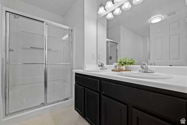 718 N 410 W, Tooele, UT 84074 - full bath featuring double vanity, visible vents, a stall shower, and a sink