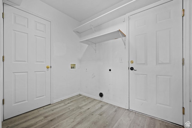 718 N 410 W, Tooele, UT 84074 - clothes washing area featuring hookup for an electric dryer, baseboards, light wood-style floors, hookup for a washing machine, and laundry area