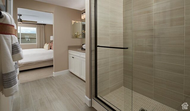 1111 W 450 S Unit 64, Brigham City, UT 84302 - full bathroom with baseboards, vanity, a stall shower, and connected bathroom