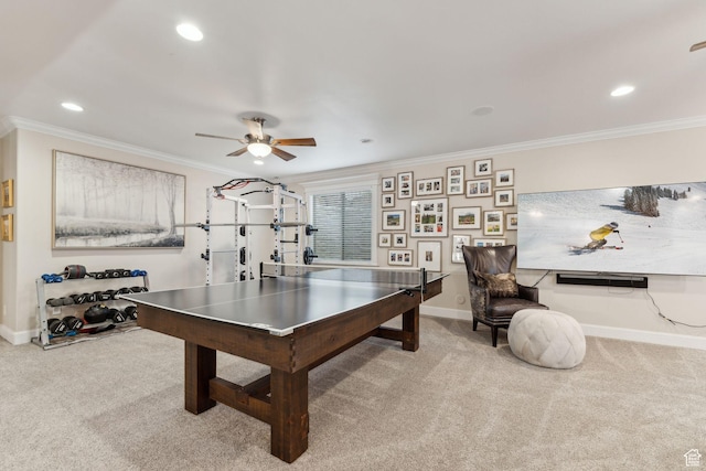 game room with carpet flooring, baseboards, recessed lighting, a ceiling fan, and crown molding