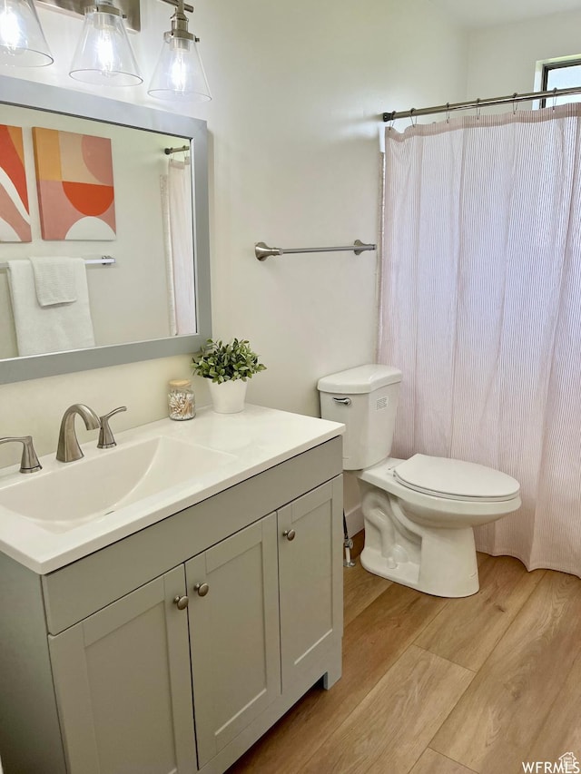 394 E Bridlewood Dr S, Salt Lake City, UT 84107 - full bathroom with toilet, vanity, and wood finished floors
