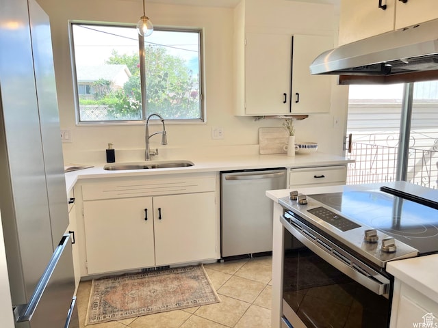 394 E Bridlewood Dr S, Salt Lake City, UT 84107 - kitchen with range hood, light countertops, light tile patterned floors, a sink, and appliances with stainless steel finishes