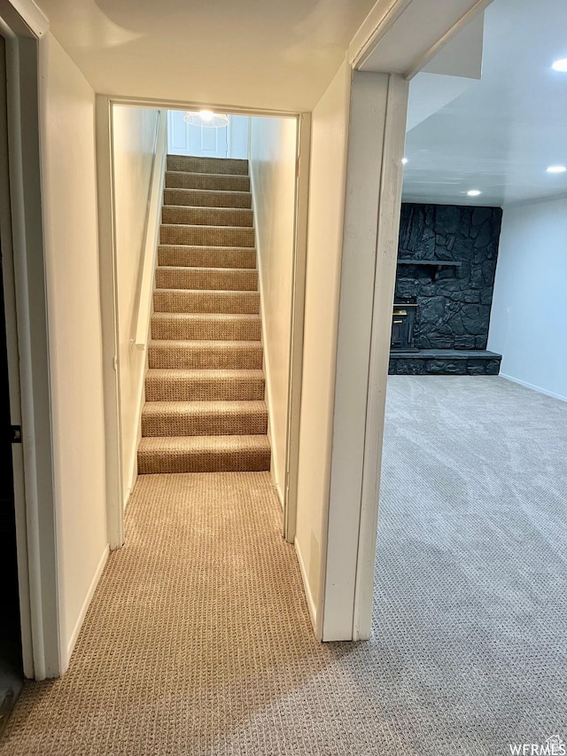 394 E Bridlewood Dr S, Salt Lake City, UT 84107 - staircase with baseboards, recessed lighting, a stone fireplace, and carpet