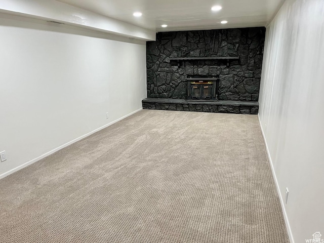 394 E Bridlewood Dr S, Salt Lake City, UT 84107 - finished below grade area with baseboards, carpet floors, a stone fireplace, and recessed lighting