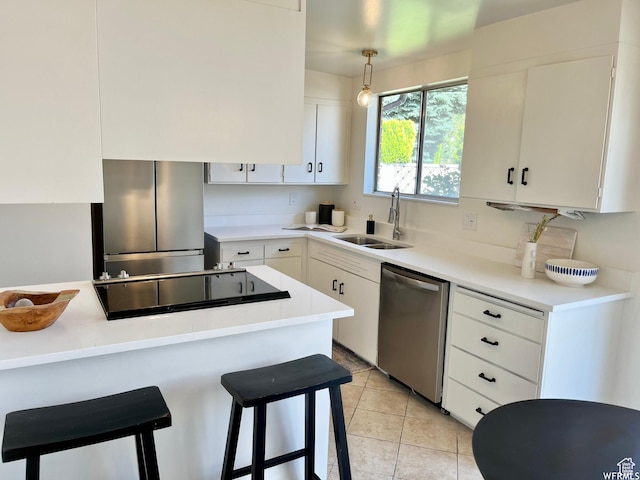 394 E Bridlewood Dr S, Salt Lake City, UT 84107 - kitchen featuring a breakfast bar, white cabinets, stainless steel appliances, and a sink