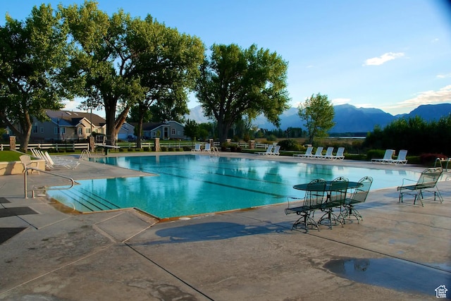 1137 S Topaz Rd, Saratoga Springs, UT 84045 - community pool featuring a patio area and a mountain view
