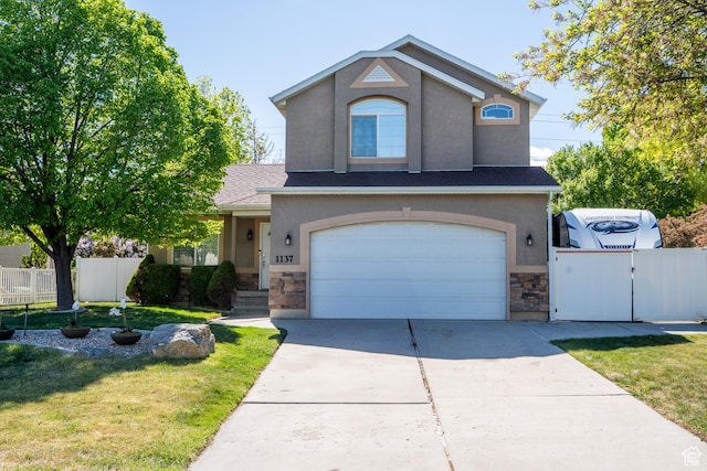1137 S Topaz Rd, Saratoga Springs, UT 84045 - traditional-style home with stone siding, stucco siding, an attached garage, and concrete driveway