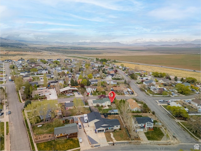 aerial view featuring a mountain view and a residential view