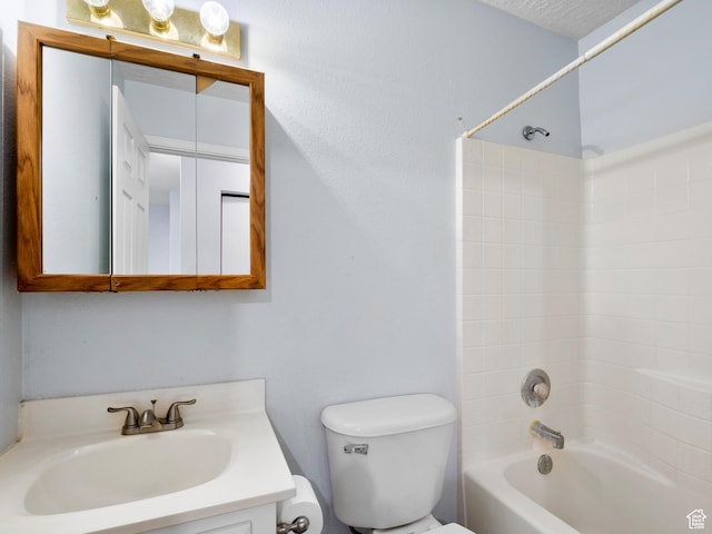 bathroom with shower / bathtub combination, vanity, and toilet