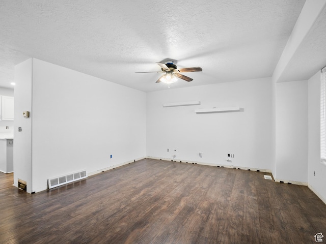 unfurnished living room with baseboards, visible vents, a wall mounted air conditioner, wood finished floors, and ceiling fan