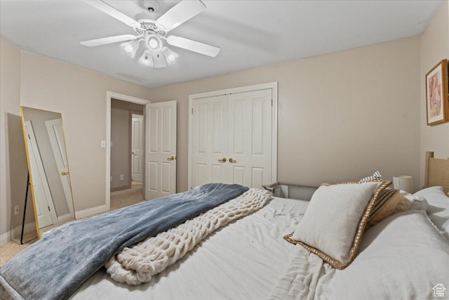 bedroom with baseboards, carpet, a closet, and ceiling fan
