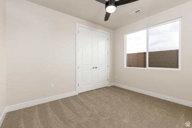 2187 W 320 S, Hurricane, UT 84737 - unfurnished bedroom with visible vents, carpet floors, a closet, baseboards, and ceiling fan