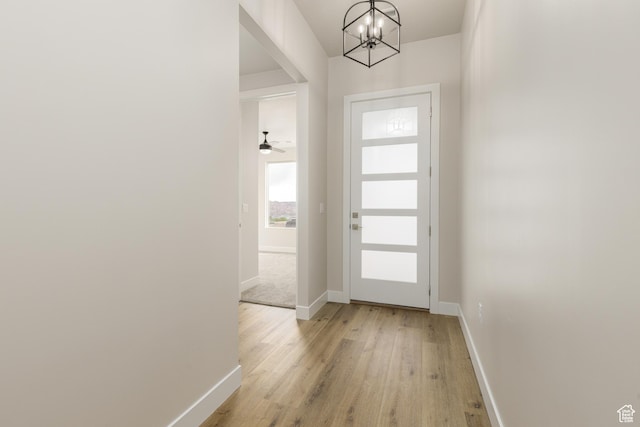 2187 W 320 S, Hurricane, UT 84737 - doorway to outside with baseboards, a chandelier, and light wood-style floors