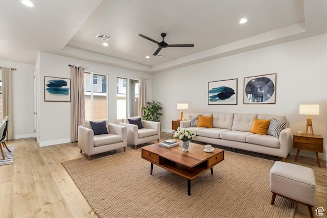 2187 W 320 S, Hurricane, UT 84737 - living room featuring ceiling fan, light wood finished floors, a raised ceiling, baseboards, and recessed lighting