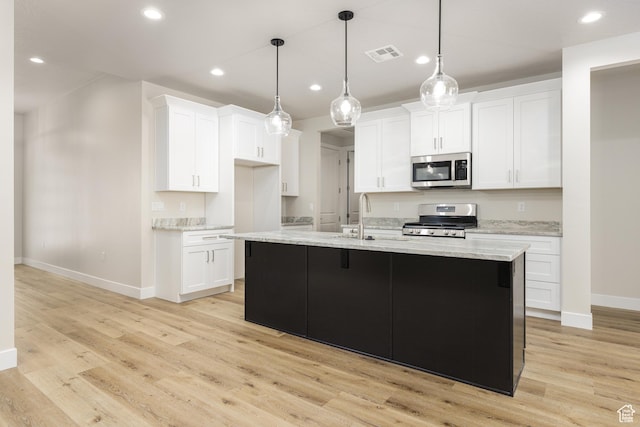 2187 W 320 S, Hurricane, UT 84737 - kitchen with recessed lighting, light wood finished floors, stainless steel appliances, visible vents, and baseboards