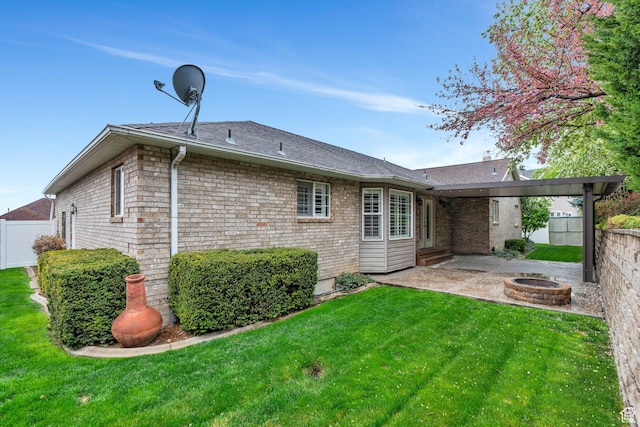 253 Ridge Rd, Orem, UT 84057 - back of property featuring a yard, fence, a patio area, and an outdoor fire pit