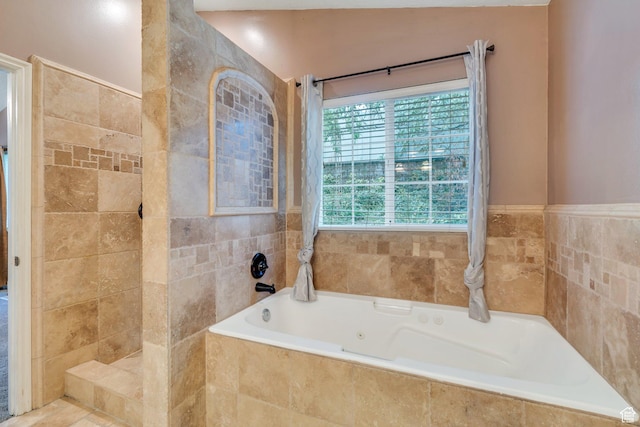 253 Ridge Rd, Orem, UT 84057 - bathroom featuring a bath and tile walls