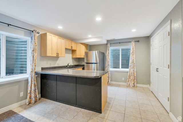 253 Ridge Rd, Orem, UT 84057 - kitchen featuring a sink, light brown cabinetry, freestanding refrigerator, baseboards, and recessed lighting