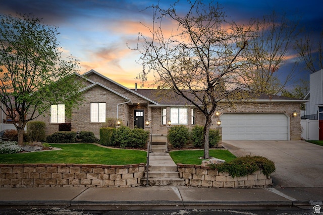 253 Ridge Rd, Orem, UT 84057 - view of front of home featuring an attached garage, driveway, brick siding, and a front yard